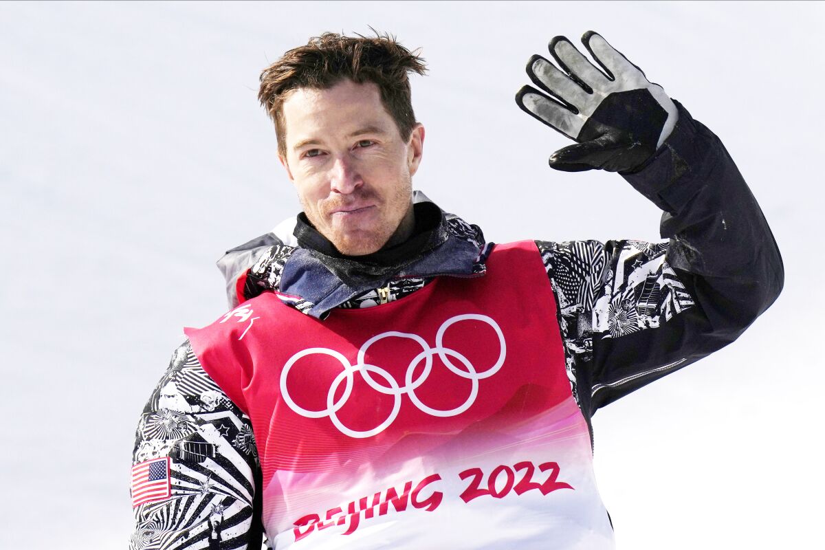 United States' Shaun White waves after competing in the men's halfpipe finals at the 2022 Winter Olympics.