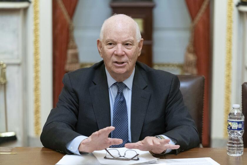 Sen. Ben Cardin, D-Md., talks to reporters as he holds Pen and Pad on assuming chairmanship of the Senate Foreign Relations Committee at the Capitol in Washington, Thursday, Sept. 28, 2023. (AP Photo/Jose Luis Magana)