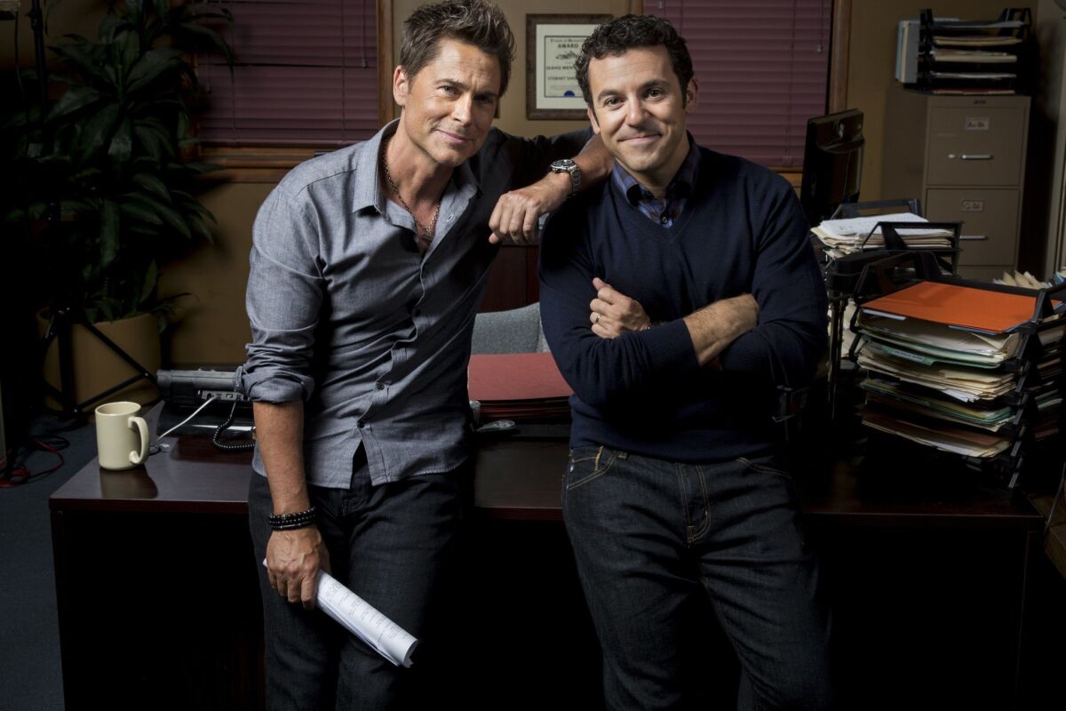Rob Lowe, left, and Fred Savage are brothers in Fox’s “The Grinder.” “We’re sort of like Simon and Garfunkel but with a lot less fighting,” says Lowe of their bond.