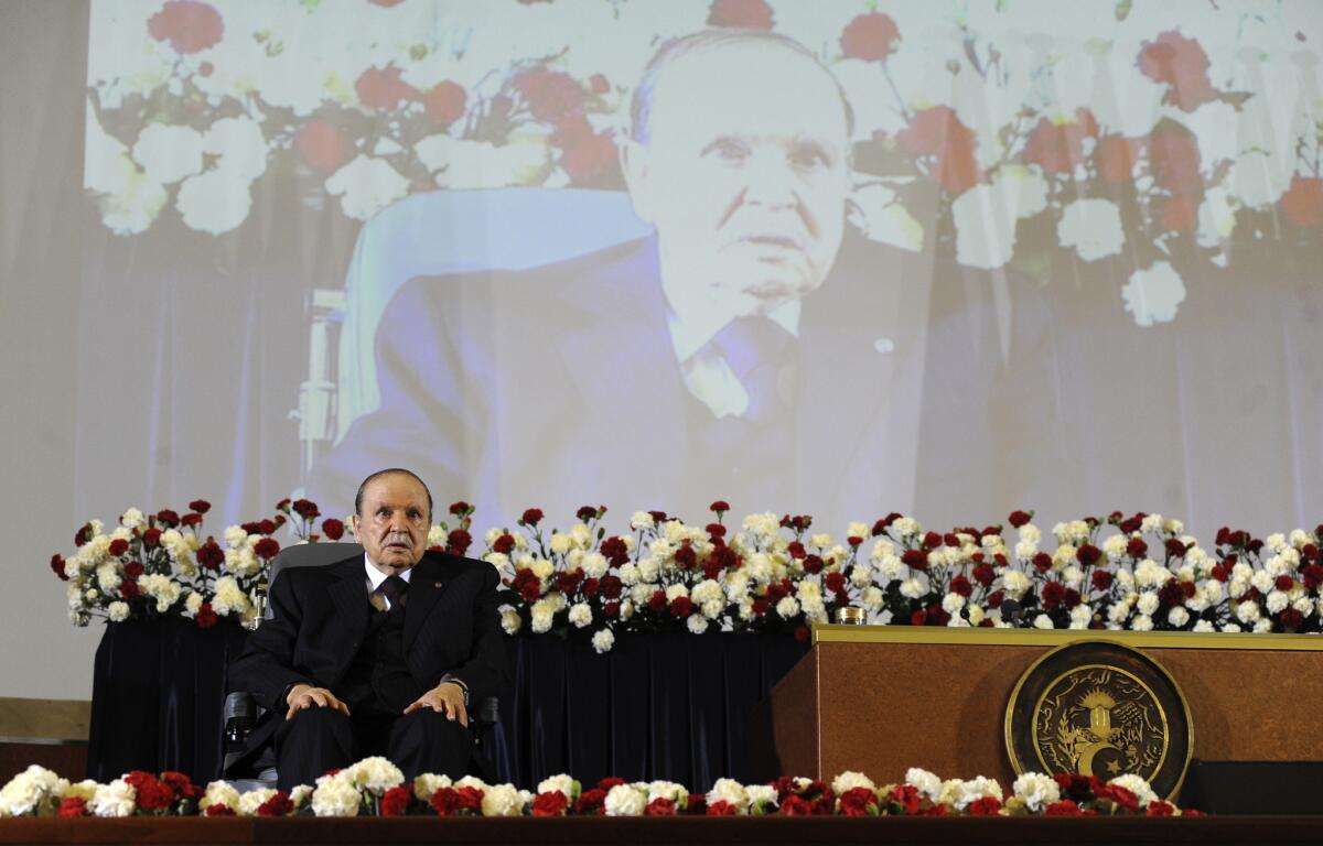 Algerian President Abdelaziz Bouteflika, in a wheelchair, listens after taking the oath of office in Algiers.