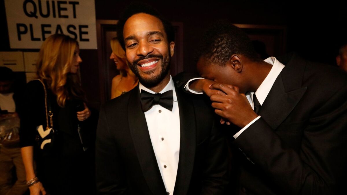 Andre Holland, left, and Ashton Sanders backstage at the 89th Academy Awards.