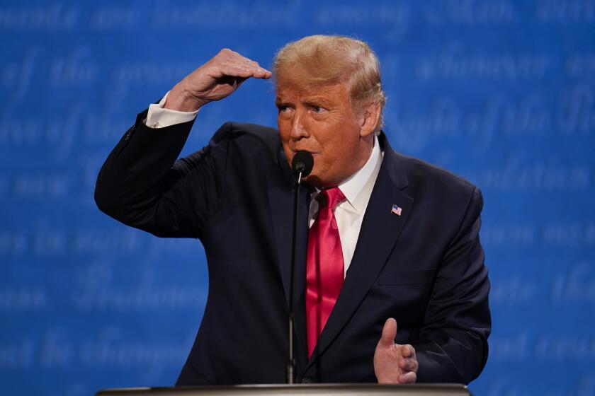 President Donald Trump gestures while speaking during the second and final presidential debate Thursday, Oct. 22, 2020, at Belmont University in Nashville, Tenn. (AP Photo/Julio Cortez)