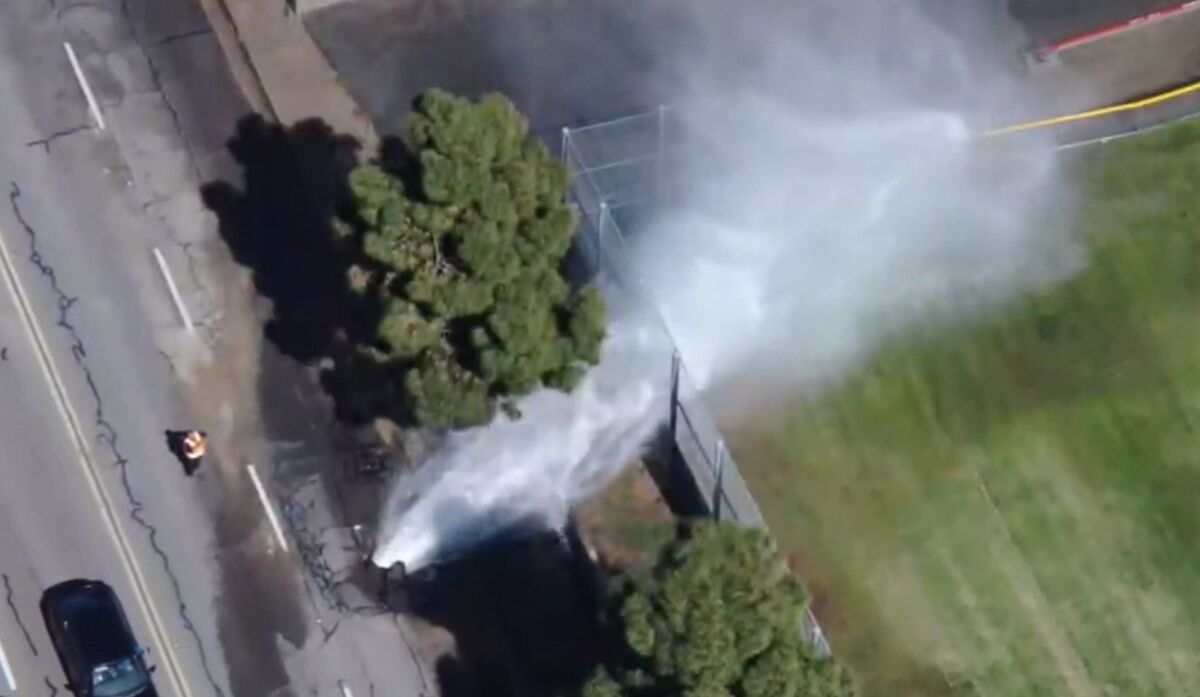 Drone image of water jetting up on East H Street in Chula Vista