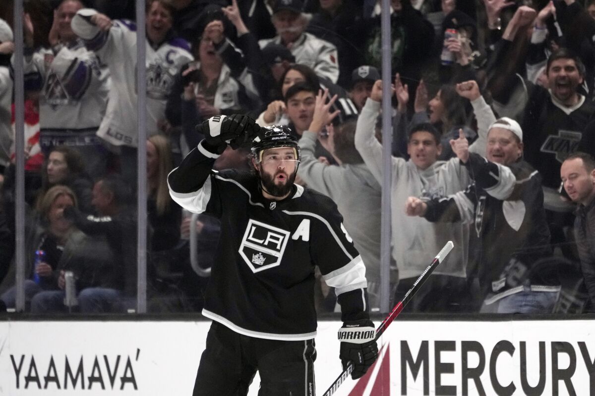 Los Angeles Kings defenseman Drew Doughty celebrates after scoring against the Calgary Flames during the first period of an NHL hockey game Monday, March 20, 2023, in Los Angeles. (AP Photo/Marcio Jose Sanchez)
