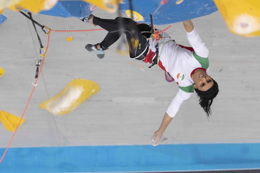 Iranian athlete Elnaz Rekabi competes during the women's Boulder & Lead final during the IFSC Climbing Asian Championships, in Seoul, Sunday, Oct. 16, 2022. Rekabi left South Korea on Tuesday, Oct. 18, 2022 after competing at an event in which she climbed without her nation's mandatory headscarf covering, authorities said. Farsi-language media outside of Iran warned she may have been forced to leave early by Iranian officials and could face arrest back home, which Tehran quickly denied. (Rhea Khang/International Federation of Sport Climbing via AP)