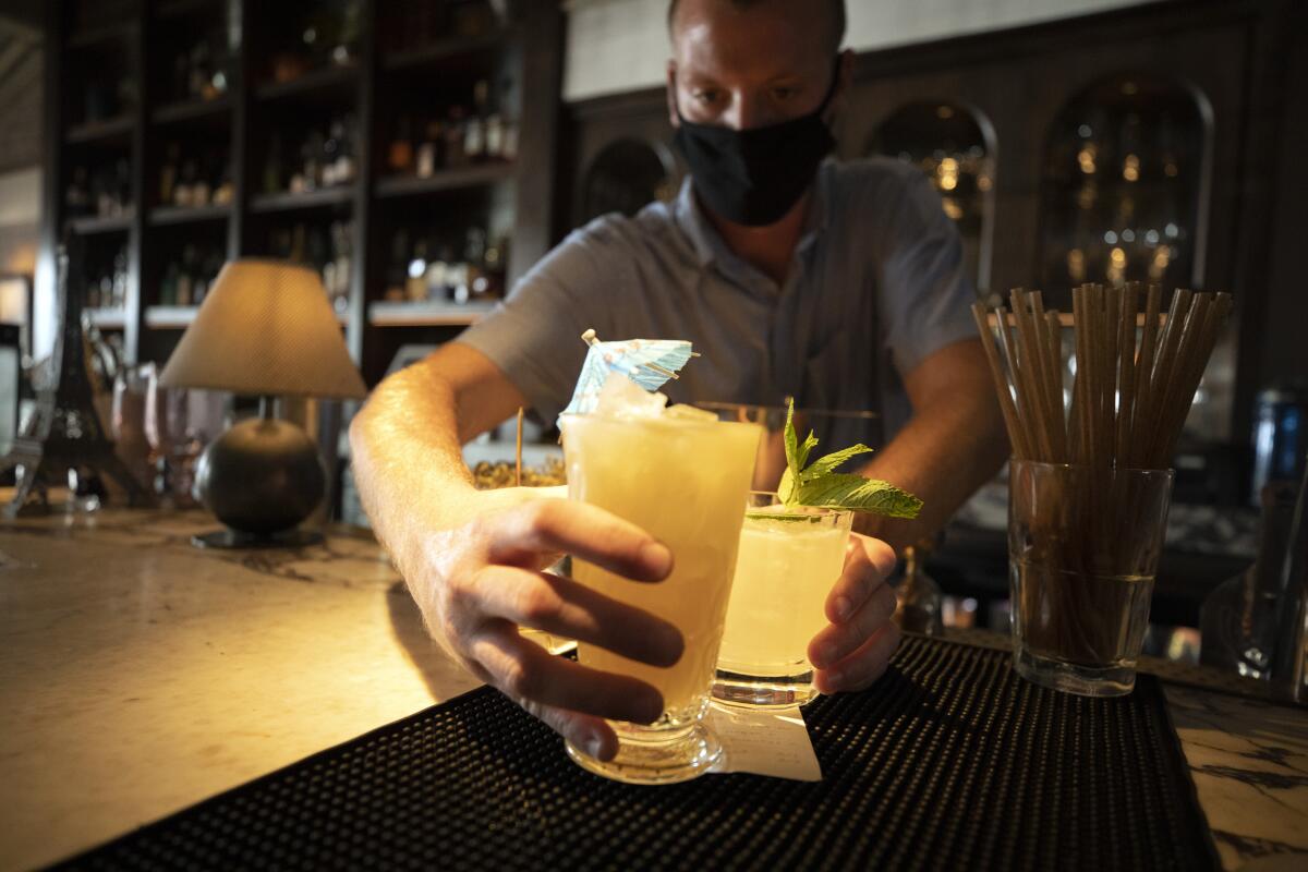 Bartender and server Brian Moylett serves up drinks at Violet.