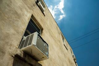 Air conditioning units installed in windows during high temperatures in Philadelphia.