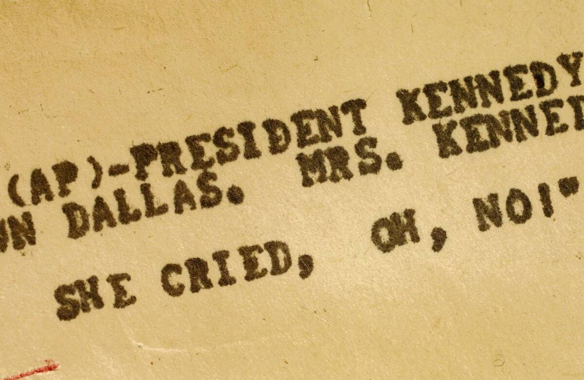 An Associated Press teletype news bulletin from Friday, Nov. 22, 1963 shows early news that President Kennedy had been shot in Dallas.