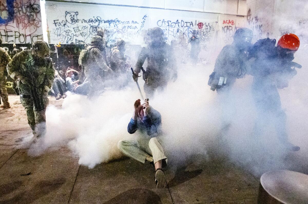Federal officers use chemical irritants and crowd control munitions to disperse Portland protesters