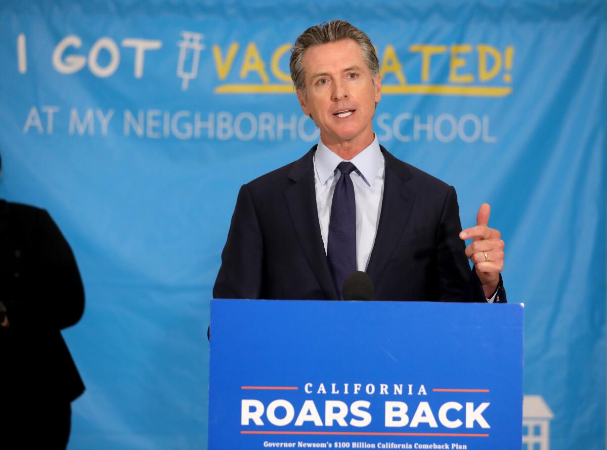 California Gov. Gavin Newsom speaks at a lectern