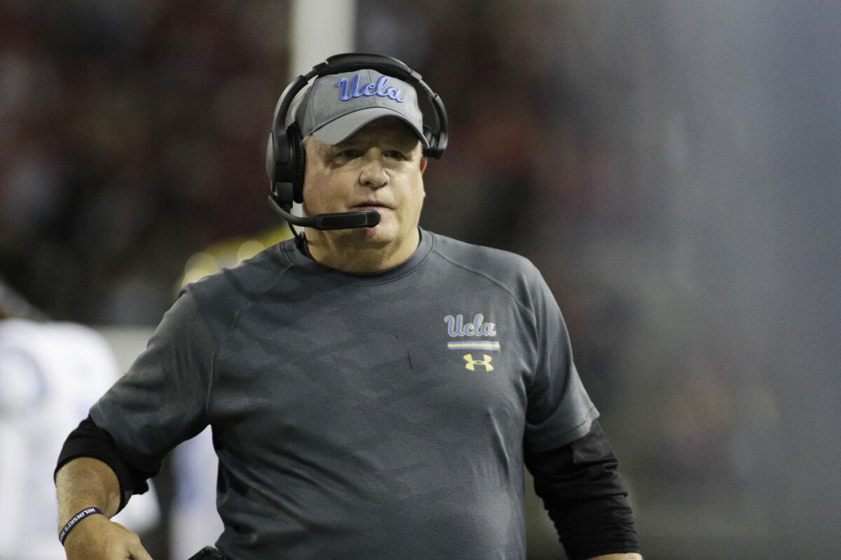UCLA coach Chip Kelly looks on from the sideline during a game.