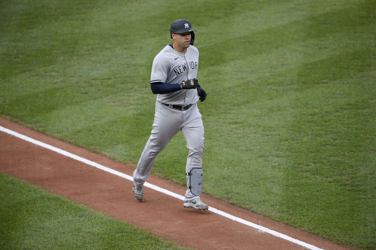 New York Yankees' Gary Sanchez trots toward home after he hit a home run during the second inning of the first baseball game of a doubleheader against the Baltimore Orioles, Friday, Sept. 4, 2020, in Baltimore. (AP Photo/Nick Wass)