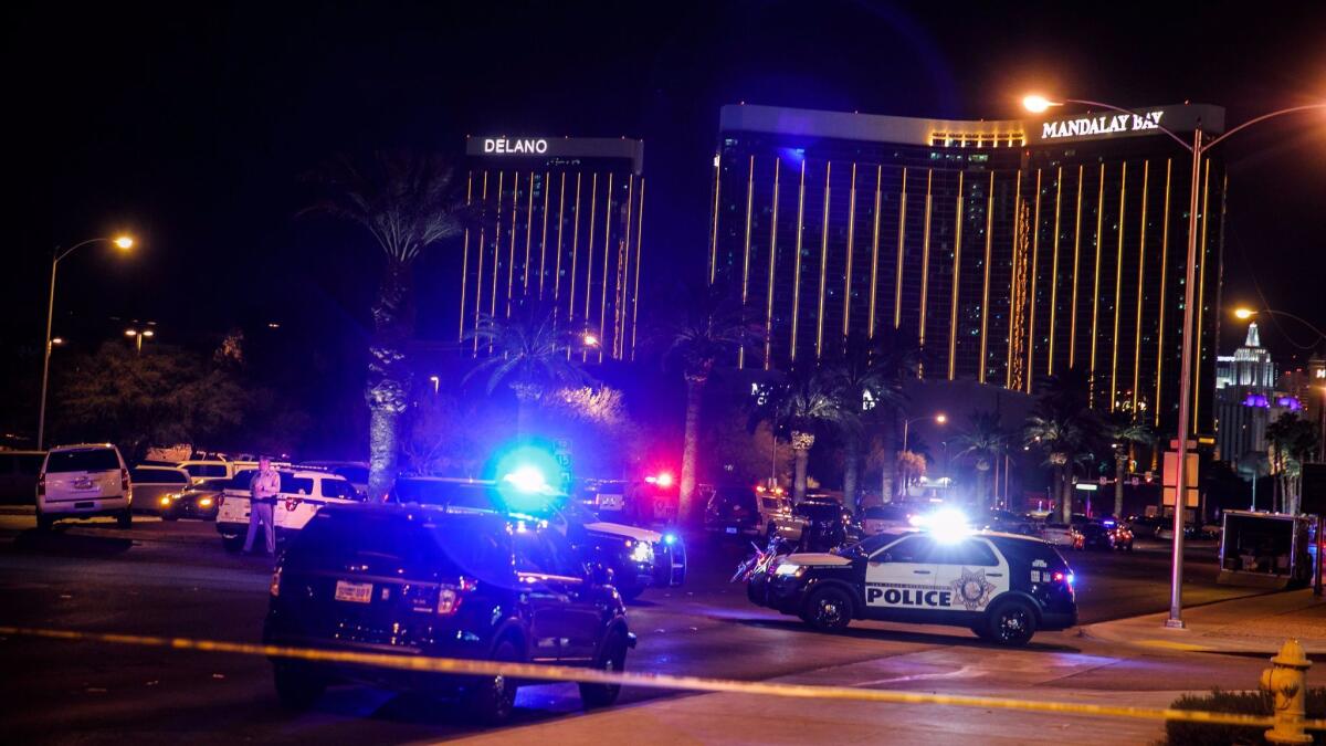 Police cordon off the area where a mass shooting at a concert killed 59 and injured more than 500 in Las Vegas.