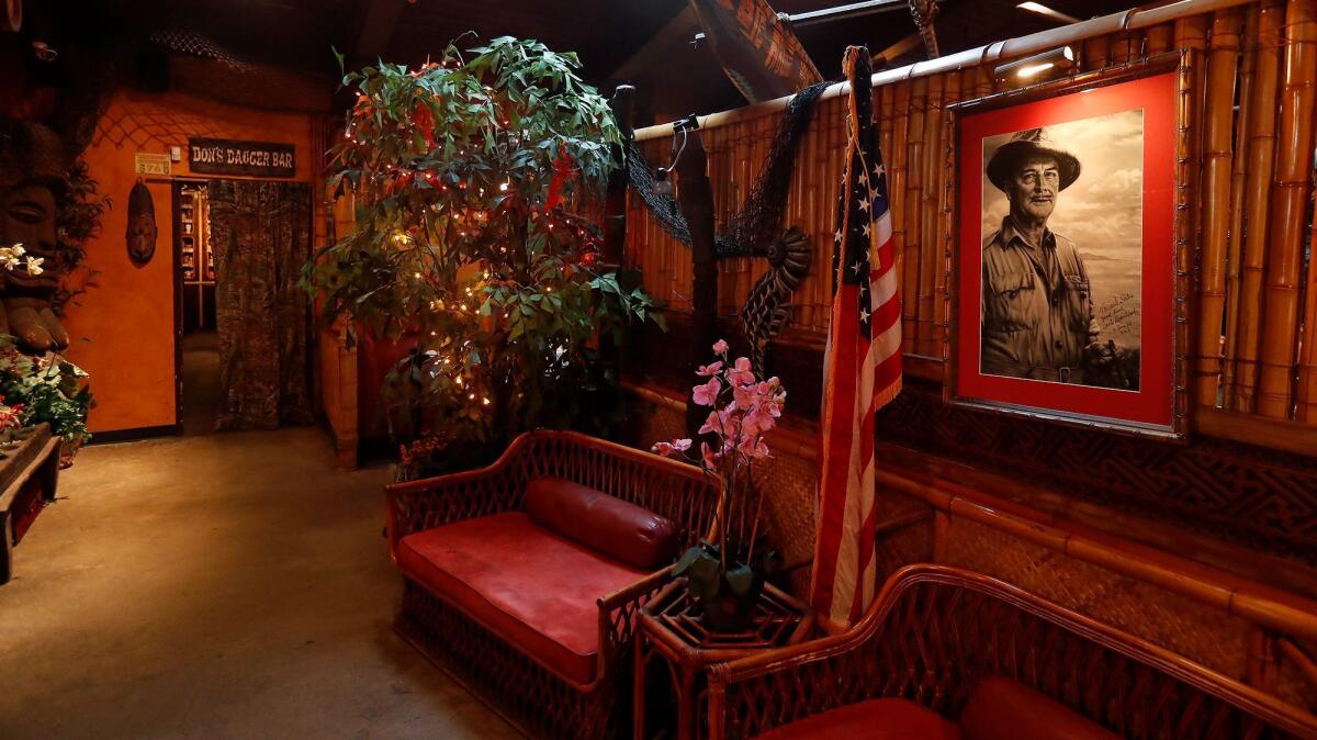 A portrait of Donn Beach hangs near the front entrance at Don the Beachcomber in Huntington Beach.