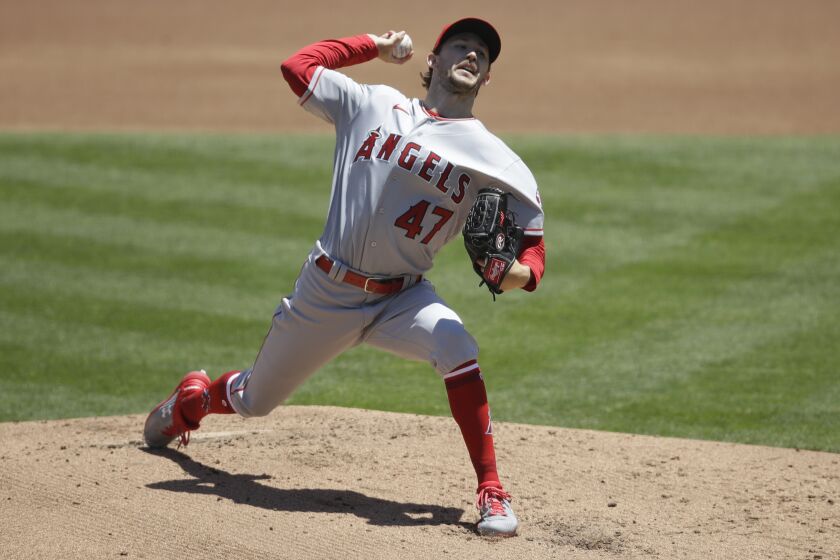Los Angeles Angels pitcher Griffin Canning works against the Oakland Athletics in the first inning of a baseball game Monday, July 27, 2020, in Oakland, Calif. (AP Photo/Ben Margot)