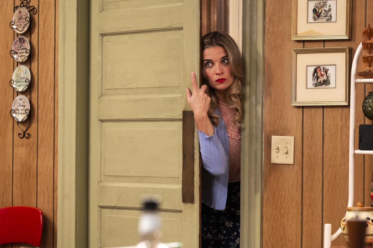 This image released by AMC shows Annie Murphy in a scene from the comedy series "Kevin Can F*** Himself." (Jojo Whilden/AMC via AP)