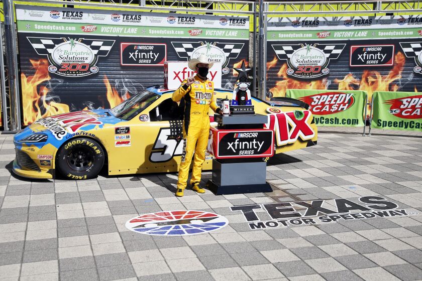 Kyle Busch celebrates in Victory Lane after winning a NASCAR Xfinity auto race at Texas Motor Speedway in Fort Worth, Texas, Saturday, July 18, 2020. (AP Photo/Ray Carlin)