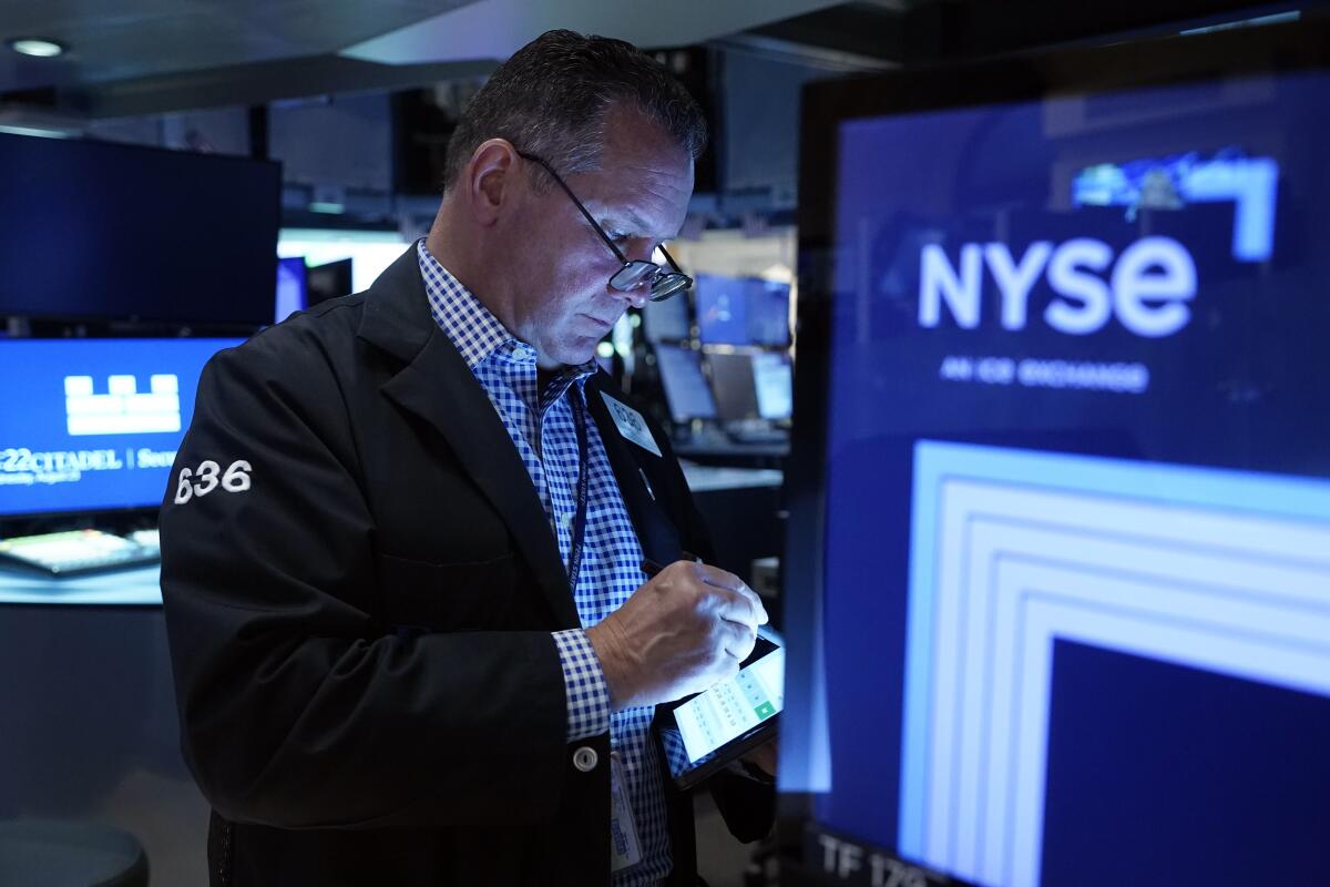 Trader Edward Curran works on the floor of the New York Stock Exchange