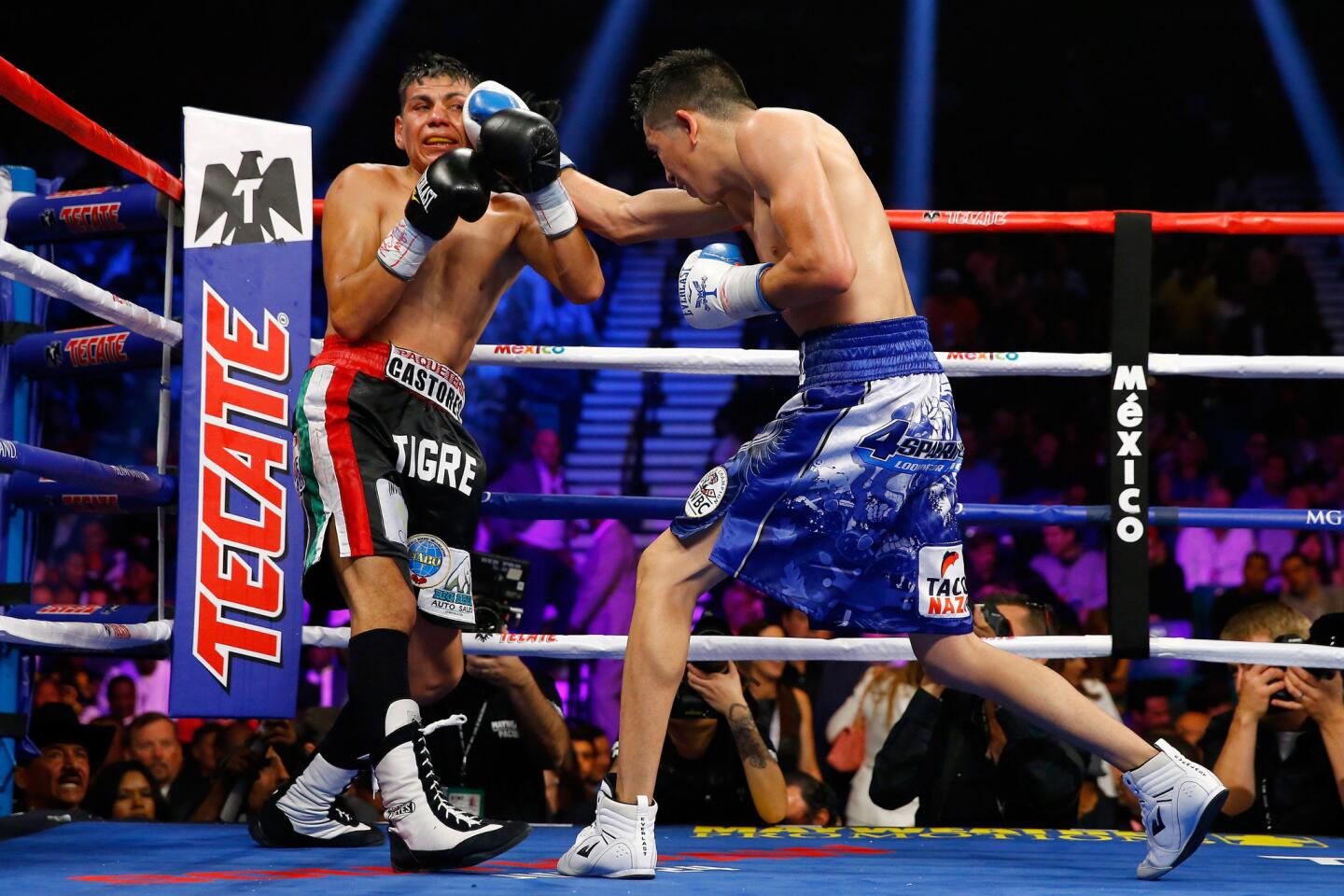 Leo Santa Cruz, right, throws a right at Jose Cayetano during their featherweight bout Saturday in Las Vegas.