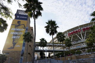 An image of baseball great Jackie Robinson featuring the words "diversity," "equality" and "unity" hangs near Petco Park.