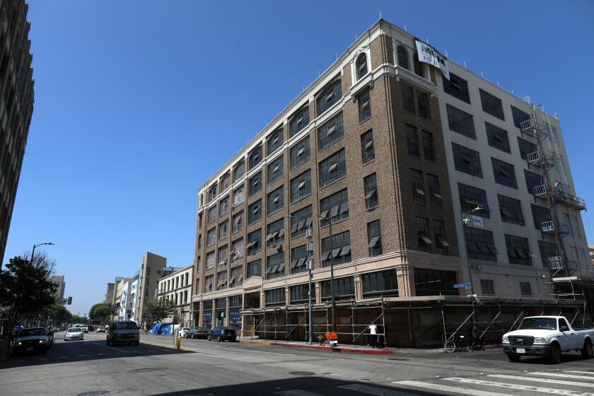 LOS ANGELES, CALIF. -- TUESDAY, JULY 16, 2019: The Historic Catalina building has been repurposed for restaurants, distribution, retail, industrial and creative office space located at 443 South San Pedro Street in Los Angeles, Calif., on July 16, 2019. Community leaders and homeless advocates held a press conference in response to the Los Angeles Department of City Planning’s rezoning of Skid Row, at LA Can. This marks the launch of a campaign to prevent the displacement of homeless people, which is being led by the Skid Row Now and 2040 Coalition – a coalition of community organizations, neighborhood activists, and social services providers. (Gary Coronado / Los Angeles Times)