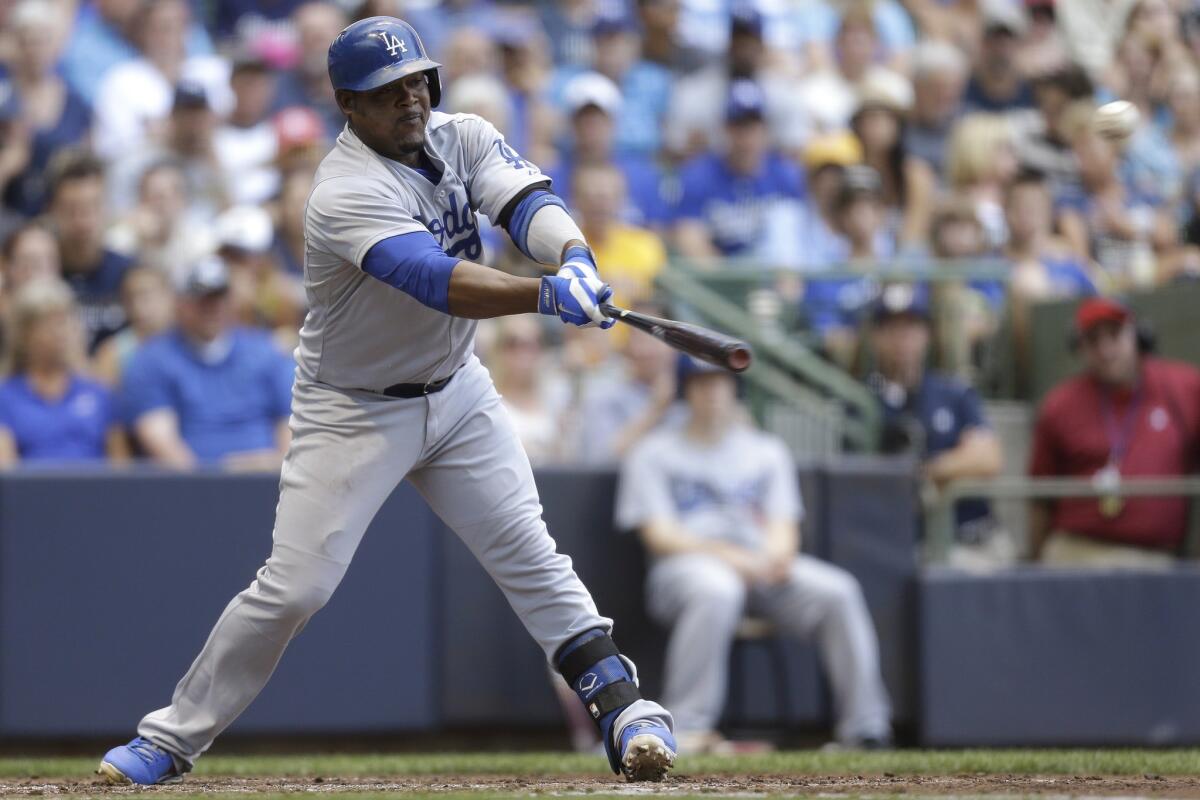 Dodgers third baseman Juan Uribe, who has already missed 44 games this season, was put back on the disabled list after suffering a hamstring injury during the team's 6-3 loss Friday to the Milwaukee Brewers.