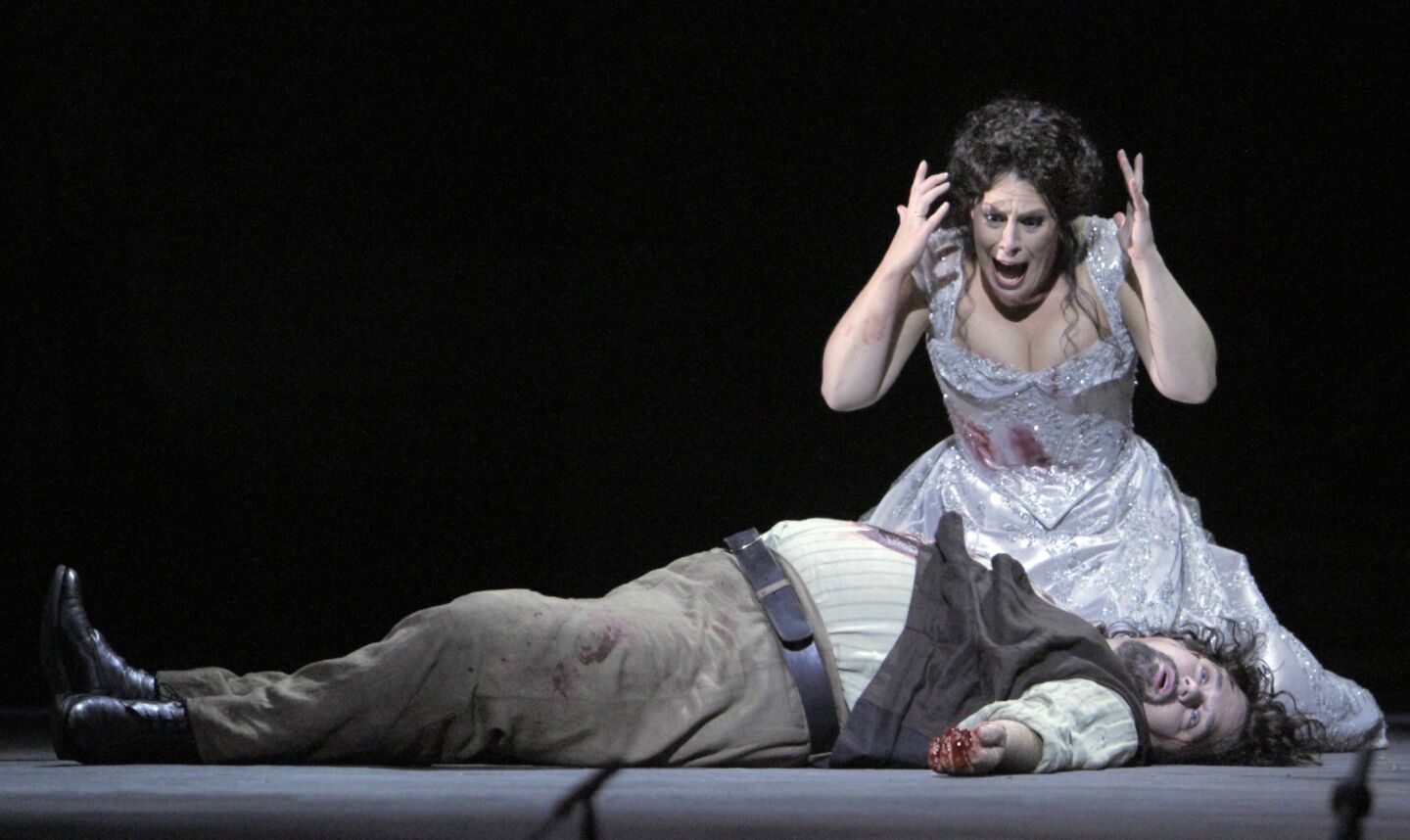 Sondra Radvanovsky as Floria Tosca and Marco Berti as Mario Cavaradossi in "Tosca" at the Dorothy Chandler Pavilion. REVIEW: With 'Tosca,' Los Angeles Opera goes for grand