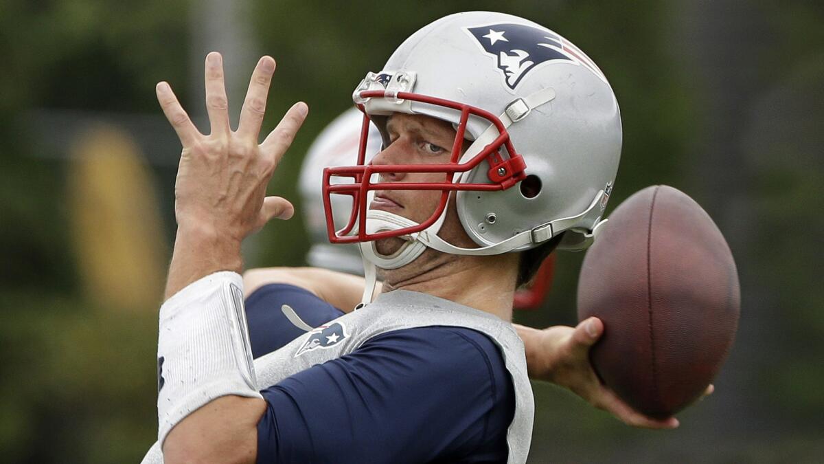 New England Patriots quarterback Tom Brady throws a pass during a minicamp training session in Foxborough, Mass., on June 16.