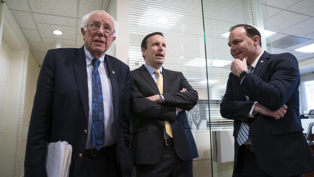 Sens. Bernie Sanders, from left, Christopher S. Murphy and Mike Lee meet before a news conference on the Senate vote on ending U.S. support for the Saudi Arabian-led coalition fighting in Yemen.