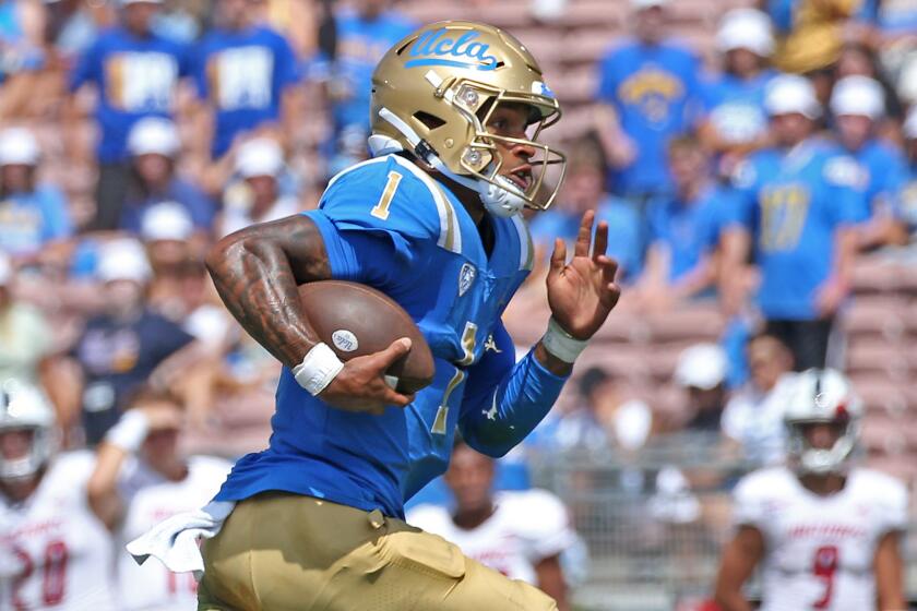 PASADENA, CA - SEPTEMBER 17: UCLA quarterback Dorian Thompson-Robinson runs for a five-yard gain.