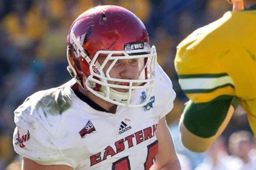 North Dakota State quarterback Easton Stick (12) throws a pass in front of the rush of Eastern Washington linebacker Ketner Kupp (40) and defensive lineman Nick Foerstel (92) during the first half of the FCS championship NCAA college football game, Saturday, Jan. 5, 2019, in Frisco, Texas. (AP Photo/Jeffrey McWhorter)