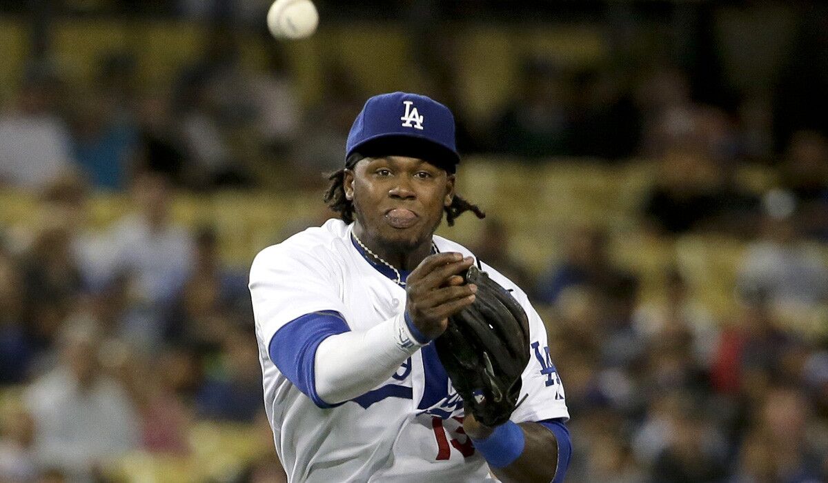 Dodgers shortstop Hanley Ramirez, making a throw to put out Colorado's Drew Stubbs in fourth inning, says his injured right ring finger did not affect his throw on an error in the seventh inning Wednesday night.