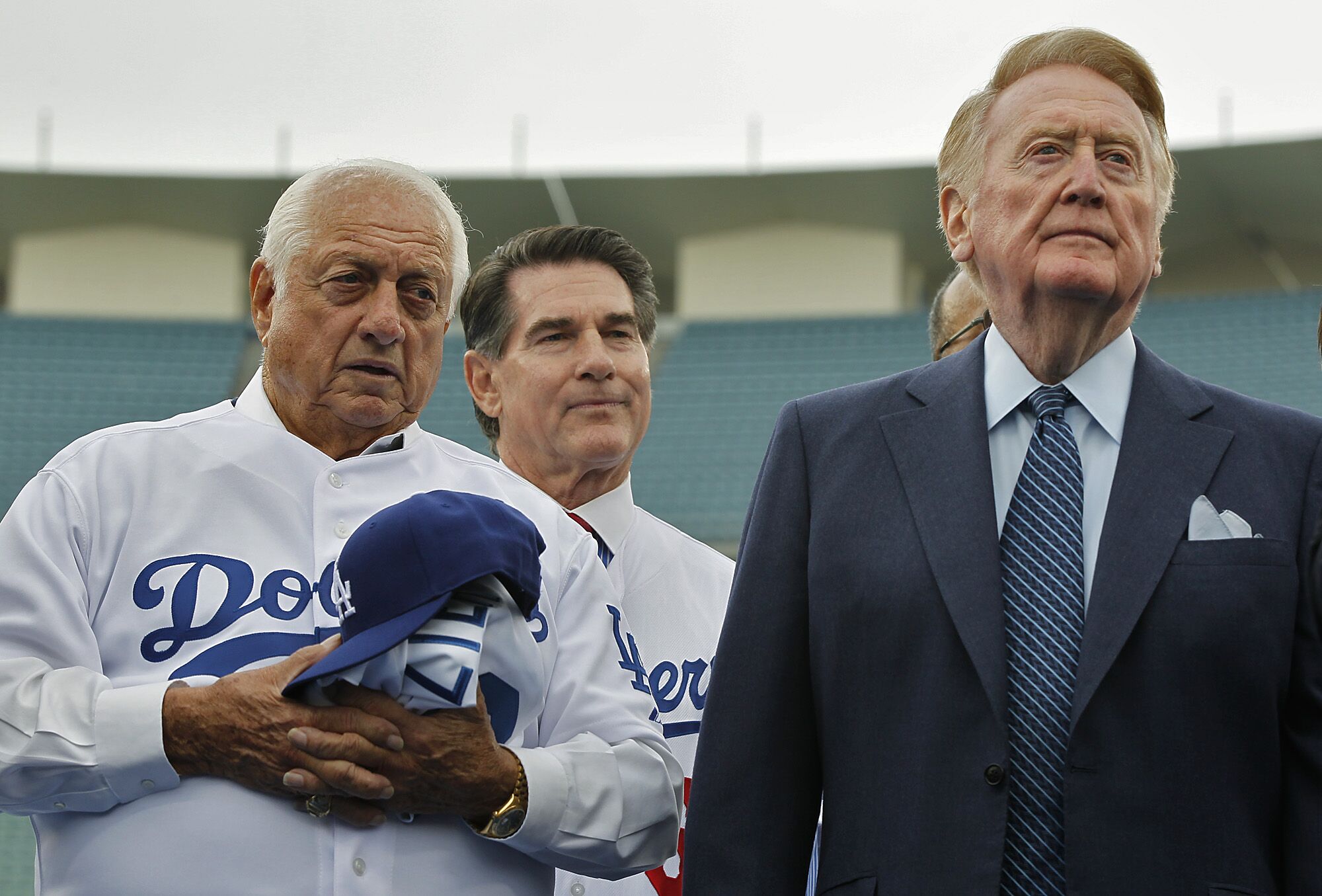 Dodgers greats (from left) Tommy Lasorda, Steve Garvey and Vin Scully attend a news conference.