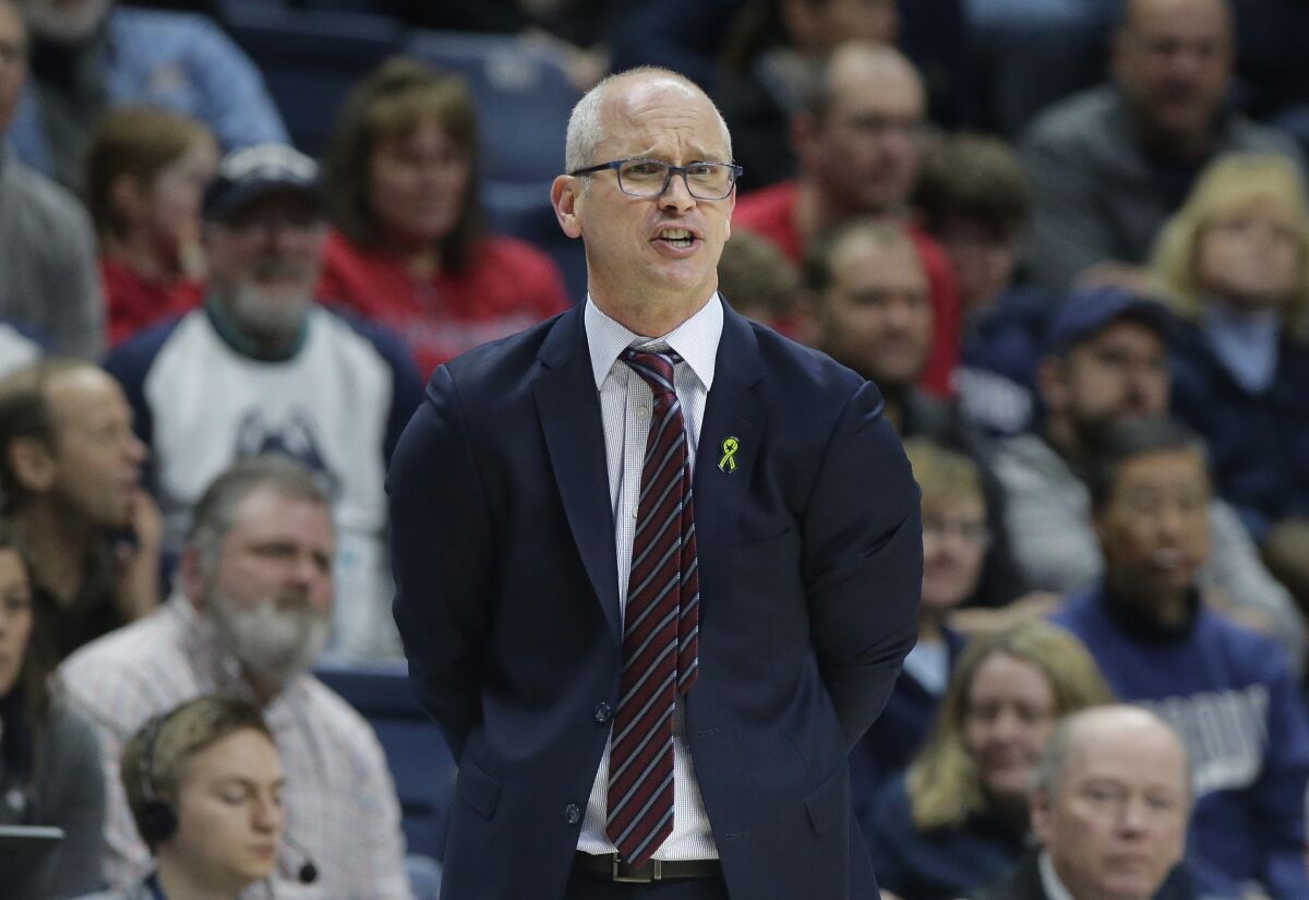 FILE - In this March 3, 2019, file photo, Connecticut coach Dan Hurley shouts from the bench during the second half of the team's NCAA college basketball game against South Florida in Storrs, Conn. Hurley said on Thursday, Nov. 12, 2020, that he is considering delaying the start of his team's season after a player's positive coronavirus test the week before that forced the program to suspend all activities for two weeks. (AP Photo/Steven Senne, File)