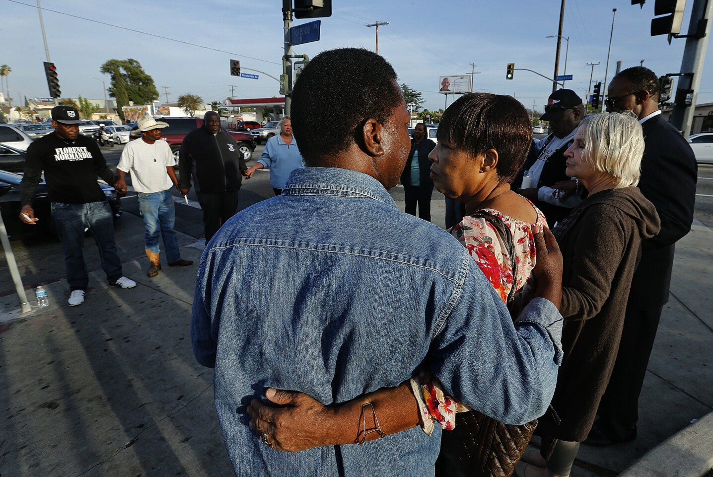 David Bryant, foreground, and his ex-wife Denise Harlins, the uncle and aunt of Latasha Harlins, at a vigil at Florence and Normandie avenues, the intersection at the center of the 1992 L.A. riots.