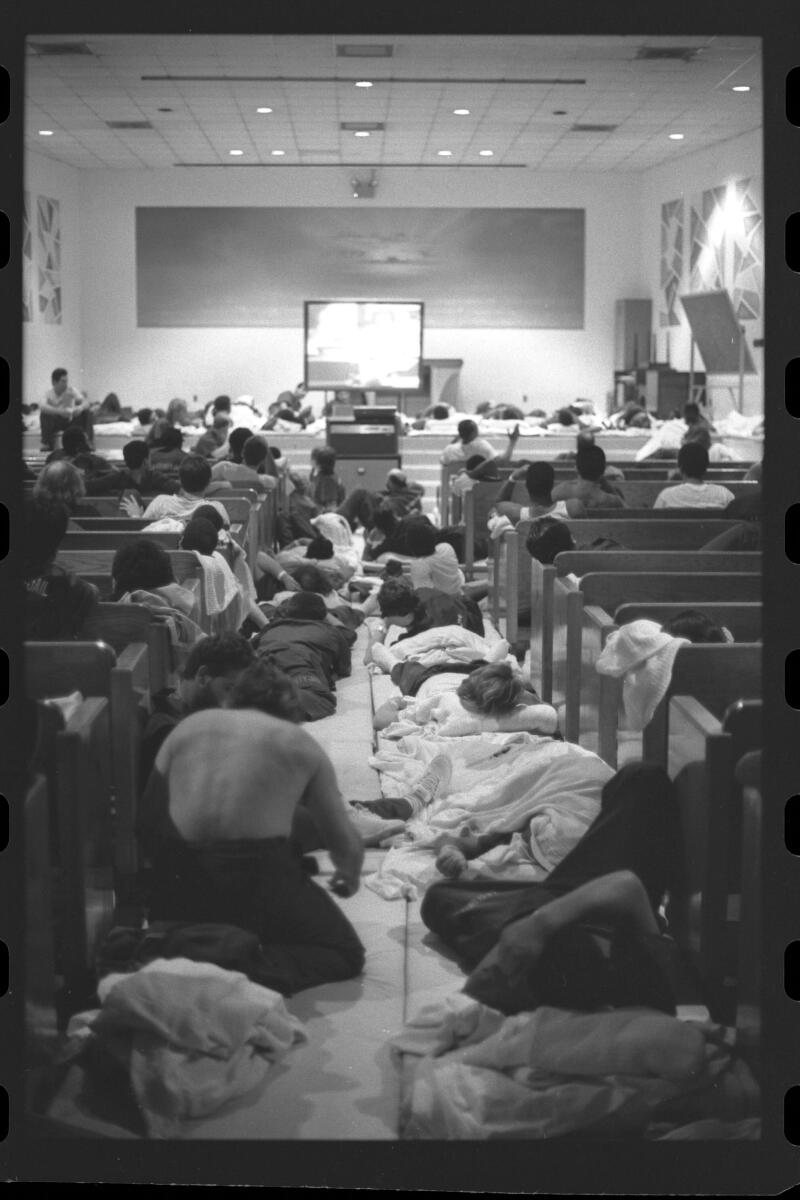 Inmates watch television as they spend the night in one of the overcrowded Central Jail's chapels on June 7, 1987.