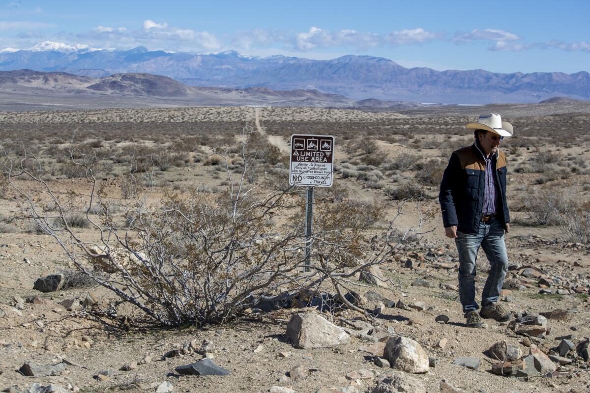 Off-roading advocate Randy Banis walks through Spangler Hills in an Off-Highway Vehicle Recreation Area that will soon be made official under the California Desert Protection and Recreation Act.