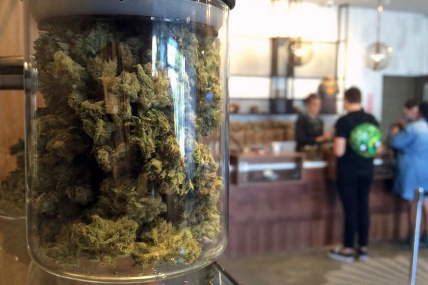 Customers buy products at a medical marijuana dispensary in San Francisco in April.