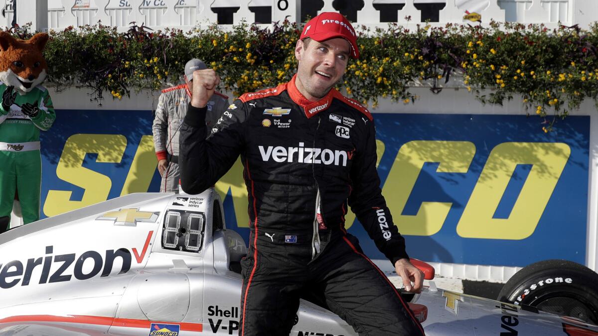 IndyCar driver Will Power celebrates after winning the ABC Supply 500 at Pocono Raceway on Sunday.
