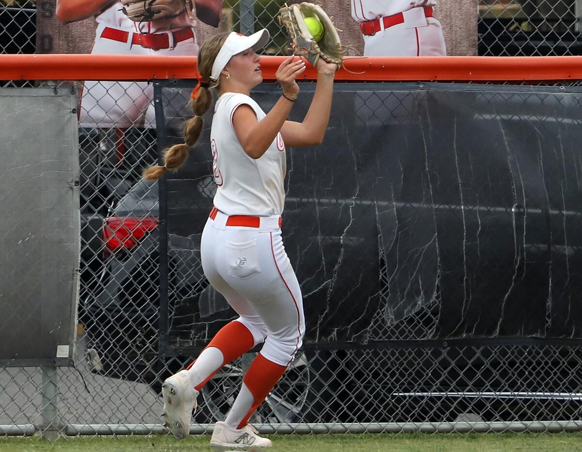 Huntington Beach's Cali Bennett (2) makes a catch in center field against Chino Hills on Saturday.