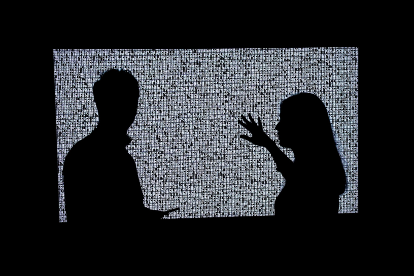 People look at a NFT by Ryoji Ikeda titled "A Single Number That Has 10,000,086 Digits" during a media preview on June 4, 2021.