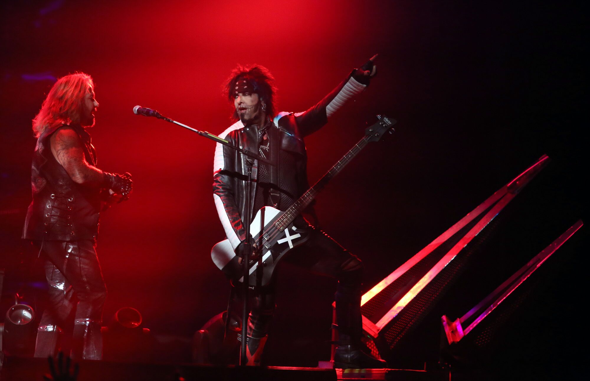 Vince Neil, left, and Nikki Sixx perform with Motley Crue at the Matthew Knight Arena in Eugene, Oregon, on July 22, 2015.