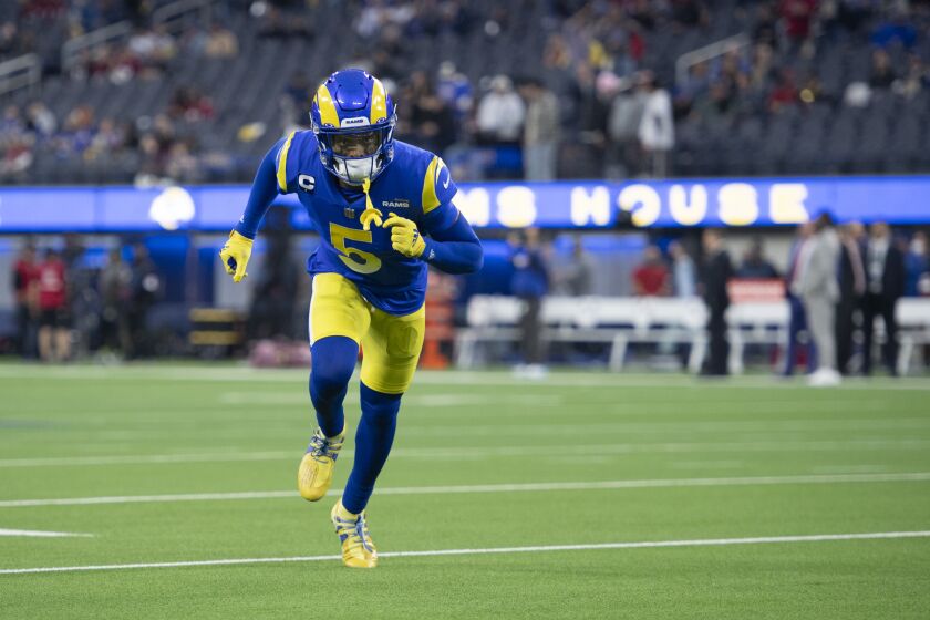 Los Angeles Rams cornerback Jalen Ramsey (5) warms up before an NFL wild-card playoff football game against the Arizona Cardinals Monday, Jan. 17, 2022, in Inglewood, Calif. (AP Photo/Kyusung Gong)