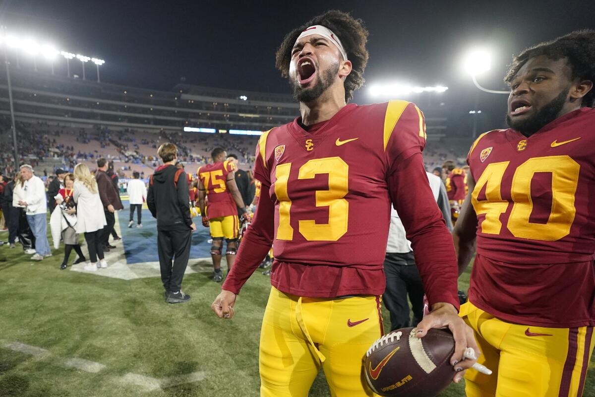 USC quarterback Caleb Williams shouts and celebrates after the Trojans defeated rival UCLA