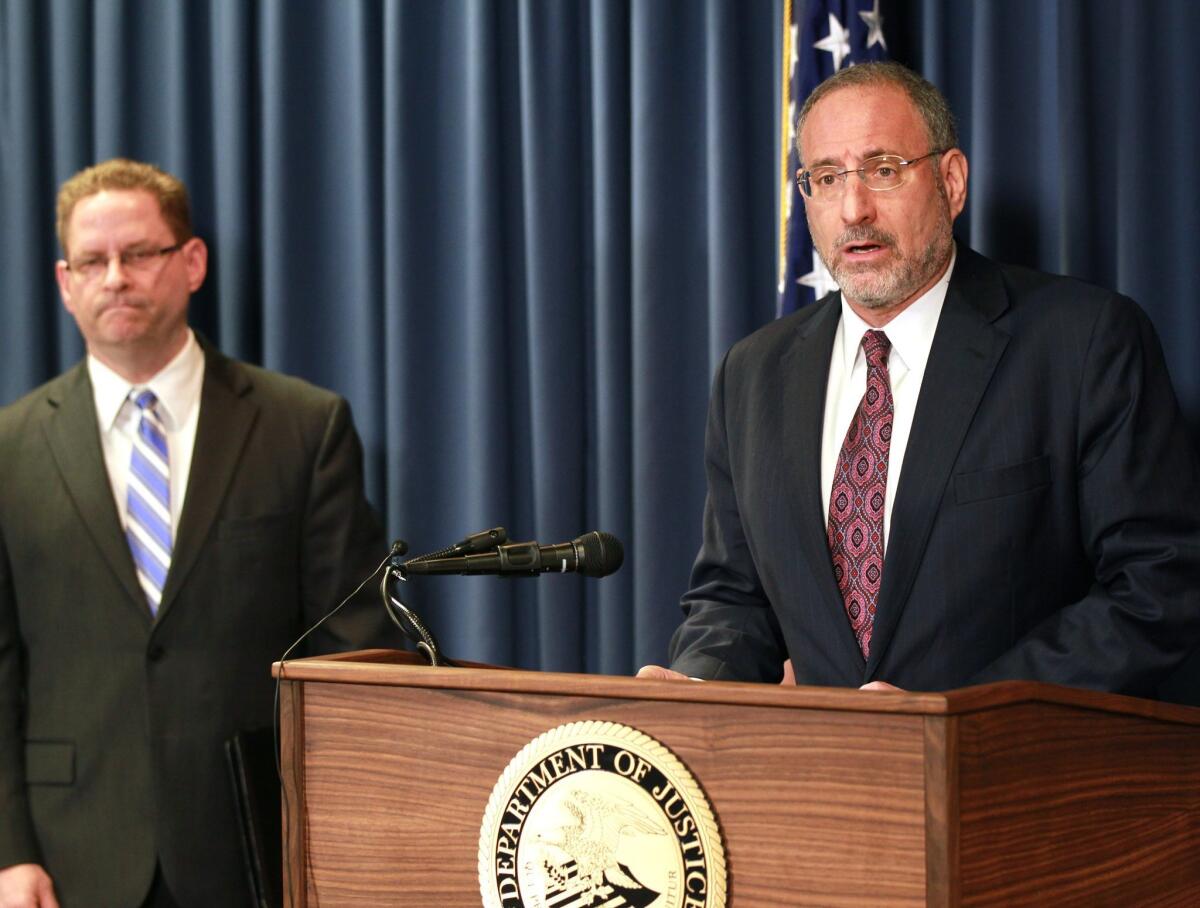 U.S. Atty. Andrew Luger, right, and FBI special agent Richard Thornton explain the criminal complaint charging six Minnesota men with terrorism at a news conference in Minneapolis.