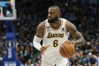 Los Angeles Lakers forward LeBron James (6) dribbles during the first quarter.
