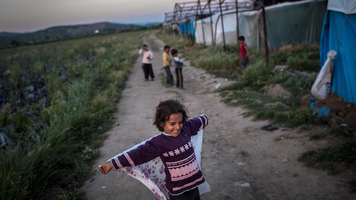A Syrian girl plays outside her makeshift home at a Turkish tent camp. Turkey had absorbed some 1.9 million refugees by the end of 2015, making it the largest host of Syrian refugees, according to the United Nations.