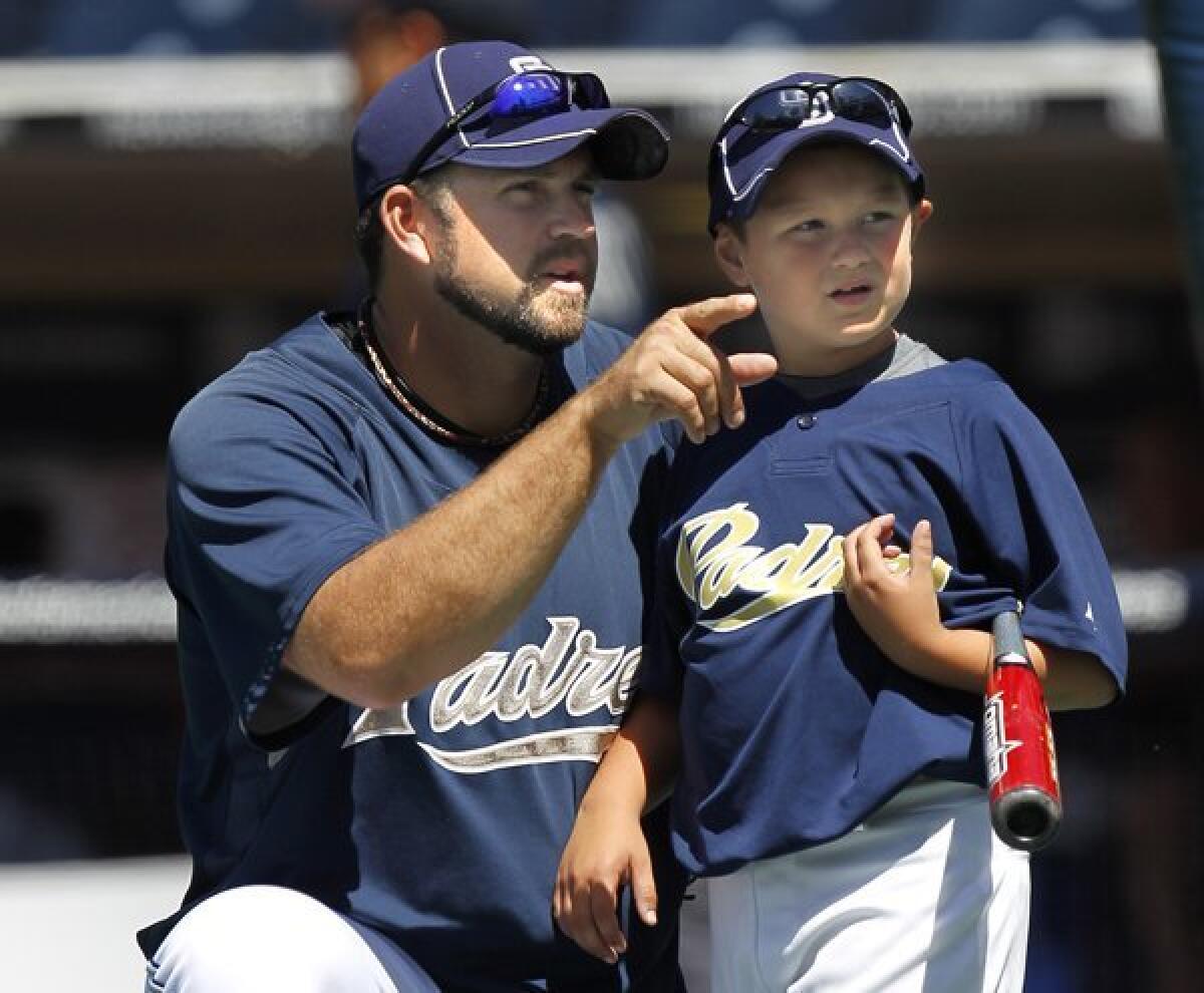 San Diego Padres pitcher Heath Bell, left, looks to the outfield