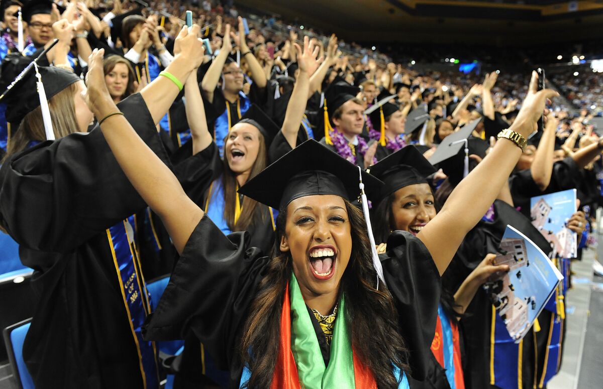 A new report says the median wages of recent college graduates have not kept pace with the pay of the overall U.S. workforce. Above, UCLA's 2013 commencement.