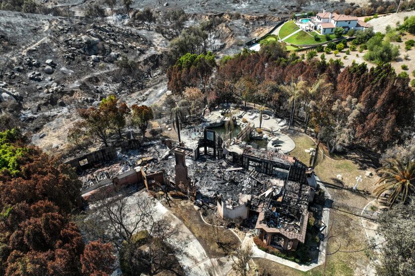 Riverside, CA, Tuesday, July 23, 2024 - A few homes were destroyed, including this one located off Canyon Hill Dr., while dozens others damaged by the Hawarden Fire that burned more than 500 acres of brush through steep canyons surrounding large estate homes.(Robert Gauthier/Los Angeles Times)